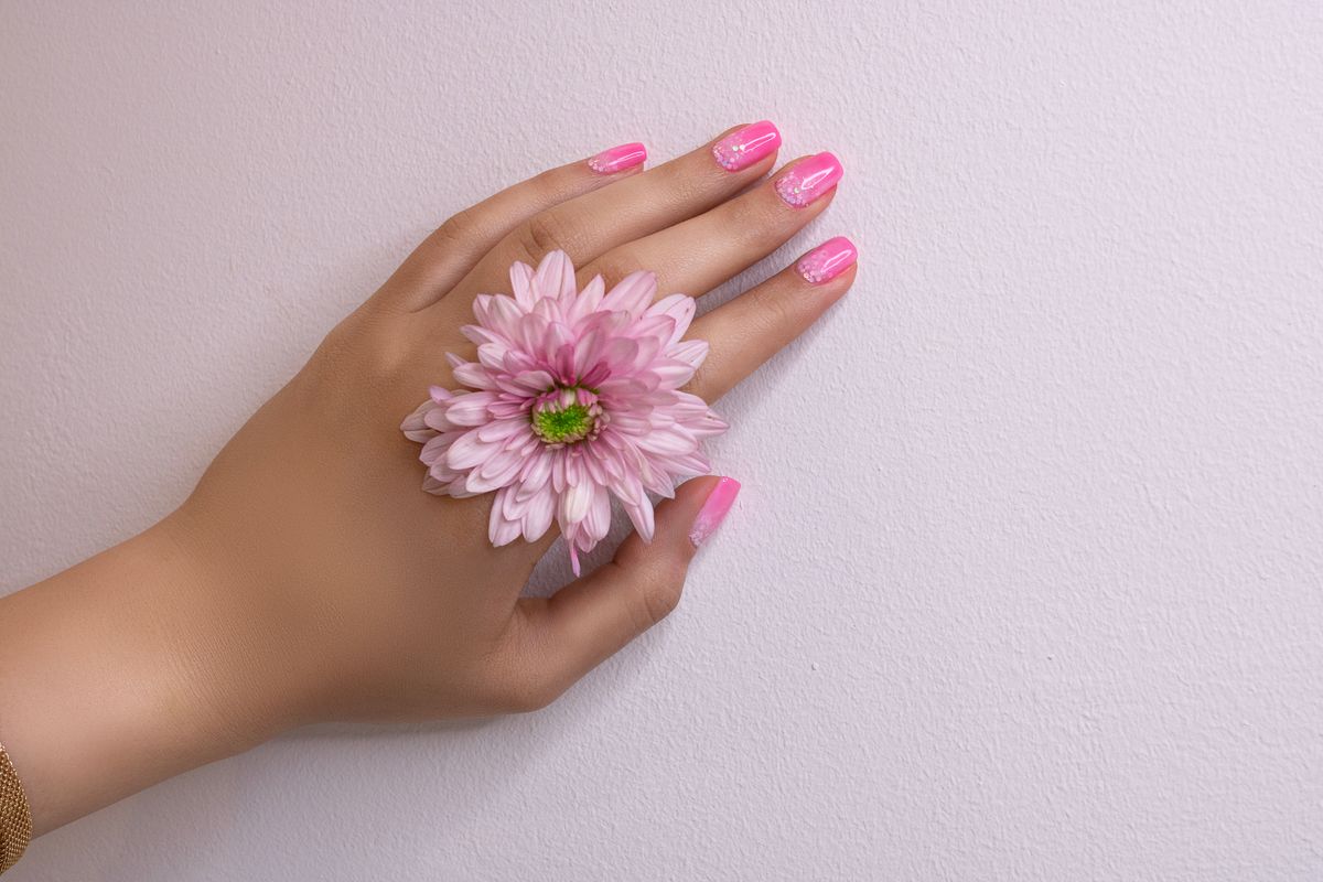 Pink manicure with floral nail art